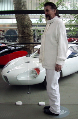 Luigi Colani (Designer of biomorphic vehicles) in front of is BMW 700 car
